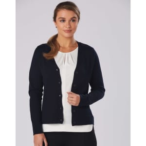 A navy blue women's 100% merino wool long sleeve cardigan with buttons, worn over a white top.