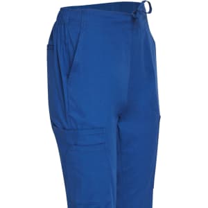 Solid blue ladies' scrub pants with an elastic waistband and side pockets, featuring a logo on the fabric.