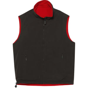 A unisex reversible vest featuring a dark exterior and a bright red interior, with side zip pockets and a high collar.