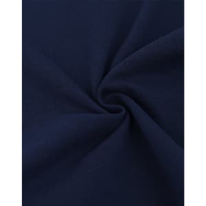 A close-up view of dark navy cotton/poly pique fabric, showcasing its texture and weave.