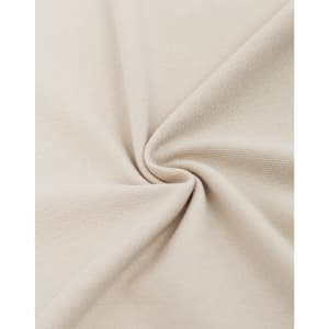 A close-up of beige cotton/polyester pique fabric, showcasing its texture and weave.