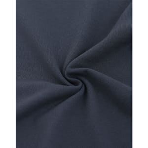 A close-up of dark navy fabric featuring a textured pique weave, highlighting its softness and quality.