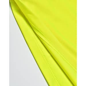 A close-up of a bright yellow polo shirt showing the fabric texture and stitching details.
