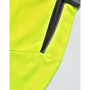A close-up view of a bright yellow polo shirt featuring a grey accent and a zippered pocket.