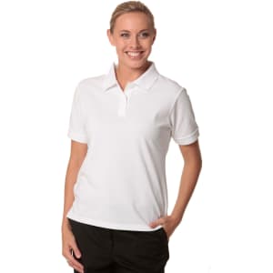 A woman wearing a white polo shirt with a collar, featuring a logo on the chest.