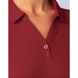 A close-up of a burgundy short sleeve polo shirt, featuring a classic collar and buttons. The shirt has a logo.