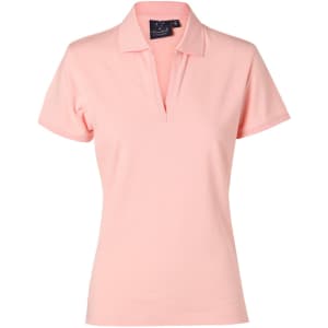 A ladies' polo shirt in a soft pink colour, featuring a collar and a branded tag.