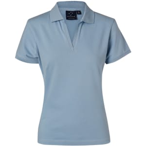 A light blue ladies' polo shirt with a collar and short sleeves, featuring a branding label.