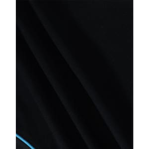 A close-up of a black polo shirt with a textured fabric and a blue accent detail.