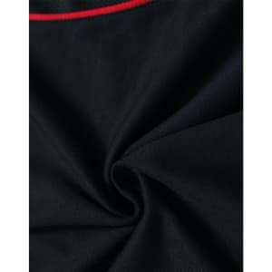 A close-up view of a black polo shirt featuring a red accent and a logo. The fabric appears soft and smooth.