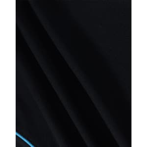 A close-up of a men's black polo shirt featuring a blue accent and a logo on the fabric.