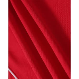 A red polo shirt made from TrueDry fabric, featuring textured material and a branding logo.