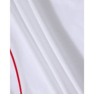 A white polo shirt featuring subtle red detailing and a textured fabric. It includes a logo.