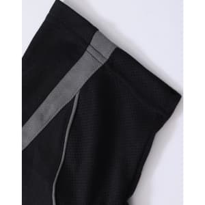 A black polo shirt featuring a grey stripe and a logo, made from breathable fabric.