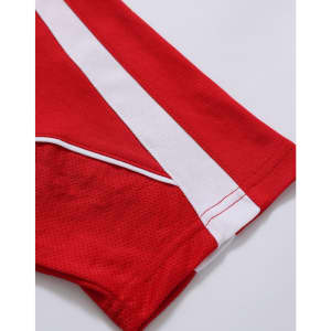 A red polo shirt with white accents on the sleeves. Features a logo on the fabric.