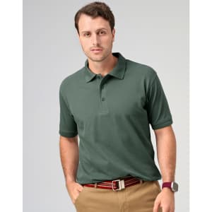 A men's cotton stretch polo in dark green, featuring a collar and a logo, paired with beige trousers.
