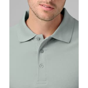 A men's cotton stretch polo in a soft green colour, featuring a collar and three-button placket.