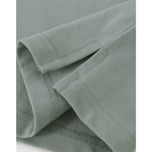 A close-up view of a light green men's cotton stretch polo shirt, highlighting the fabric and stitching details.
