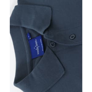 A dark blue cotton stretch polo shirt featuring a collar and buttons, with a visible brand tag.