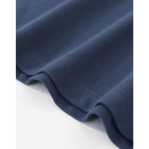 A navy cotton stretch polo shirt displayed flat, showcasing the fabric texture and stitching details.