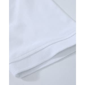 A close-up of a white cotton stretch polo shirt, showcasing the fabric and hem details. The shirt has a logo.