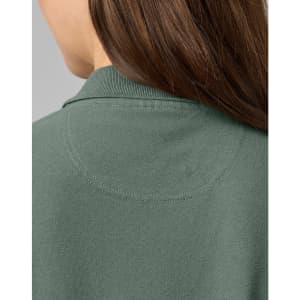A close-up of the back of a ladies cotton stretch polo shirt in a muted green colour, featuring a collar and stitching details.