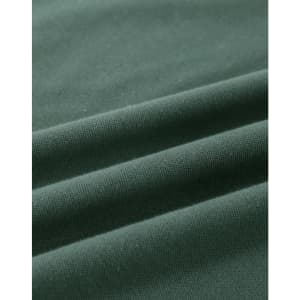 A close-up of a folded green cotton fabric, showcasing its soft texture and stretchability.