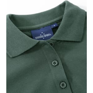 A green ladies cotton stretch polo shirt featuring a collar and three buttons, with a brand label visible.