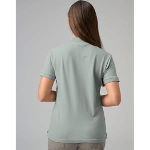 A ladies cotton stretch polo shirt in a muted green colour, featuring a collar and short sleeves.