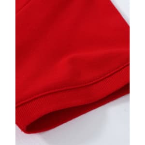 A close-up of a red cotton stretch polo shirt, highlighting the fabric and hem detail. The shirt features a logo.