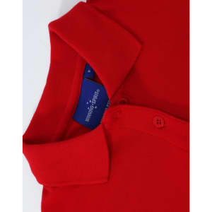 A red ladies cotton stretch polo shirt with a collar and buttons, featuring a logo inside the collar.