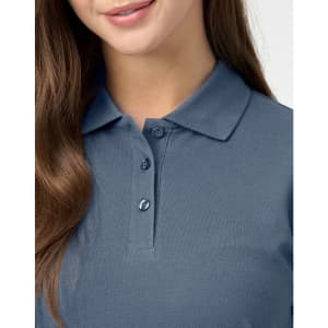 A ladies cotton stretch polo in a dark blue colour, featuring a collared neckline and button detail.