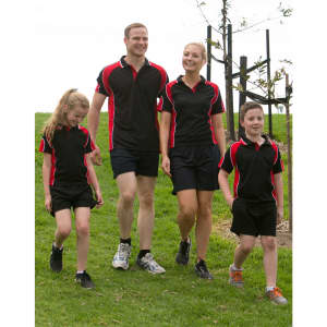 A group of four people wearing matching black and red Men's Alliance polo shirts and shorts, walking on grass.