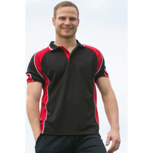 A men's polo shirt in black with red accents and a logo. The model is smiling and standing outdoors.
