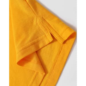 A close-up of a folded yellow polo shirt, highlighting the collar and sleeve details. The fabric appears textured and vibrant.