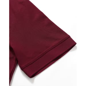 A maroon polo shirt with short sleeves, featuring a neatly finished collar and a logo.