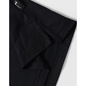 A black polo shirt with a short collar and branded tag detailing at the neckline.