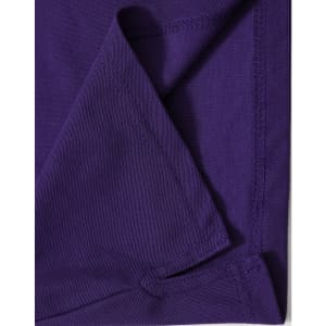 A purple polo shirt featuring a textured fabric and neat stitching, with a logo on the label.