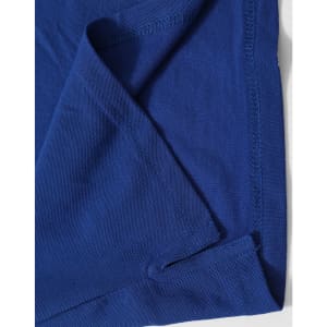 A navy blue polo shirt with a textured fabric and folded hem detail. Features branding on the label.