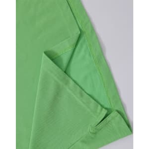 A green ladies' polo shirt featuring a folded sleeve and a hem detail, with a small logo present.