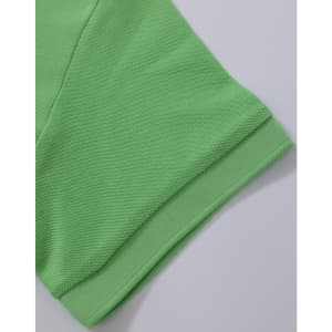 A vibrant green Ladies' Truedry Pique Polo showcasing the sleeve and hem details. Features a logo.
