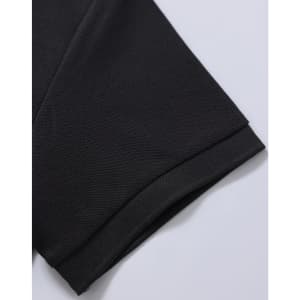 A black polo shirt sleeve featuring a textured fabric and a subtle hem. The garment has a logo on the label.