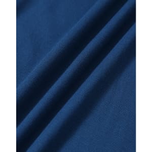 A close-up of a textured fabric in deep blue, featuring soft drapes and folds. The fabric is suitable for polo shirts.