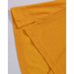 A close-up of a yellow polo shirt featuring folded sleeves and a logo.