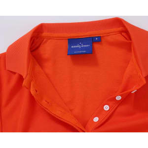 An orange polo shirt with a collar and buttons, featuring a label inside.