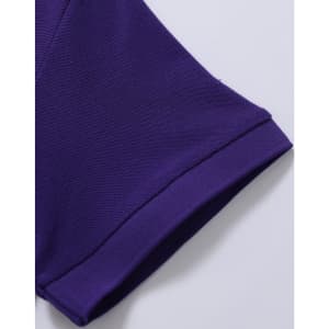 A close-up of a purple polo shirt sleeve, featuring a branded logo and textured fabric.