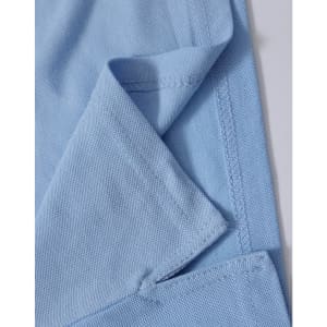 A close-up of a light blue polo shirt, highlighting the fabric texture and stitching details. The shirt features a logo.