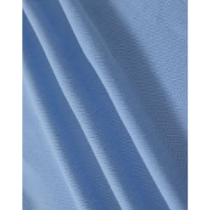 A close-up of light blue fabric with a textured surface, suitable for polo shirts. It has a branding logo.