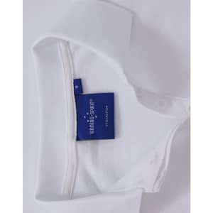 A white polo shirt featuring a tag and a collar. The shirt has buttons and a branding logo.