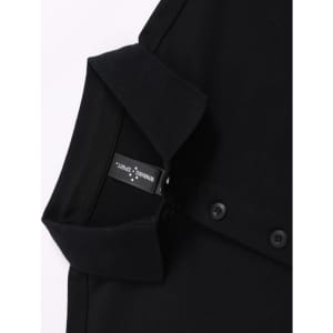 A black ultrafine cotton pique polo featuring buttons and a collar, with a visible brand label.